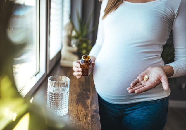 Pregnant woman using medication. Image by Dragana Gosic via Shutterstock