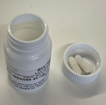 An open bottle of alpibectir capsules, a potent tuberculosis (TB) treatment.