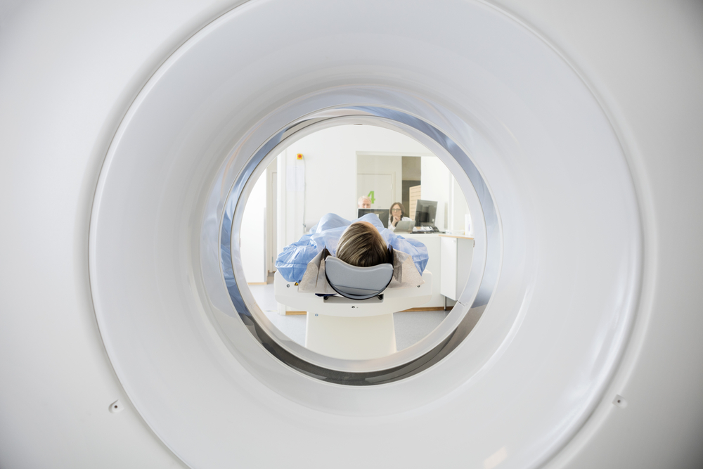 Woman in a CT scan. Image by Tyler Olson via Shutterstock