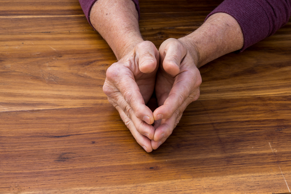 Psoriatic arthritis can cause pain and joint stiffness, among other symptoms. Image by Jacques Hugo via Shutterstock