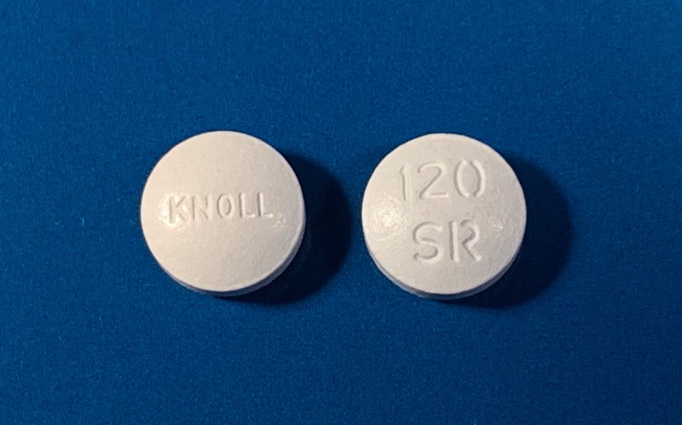 Image of 2 pills on a blue background. Verapamil pill courtesy ofUniv Graz