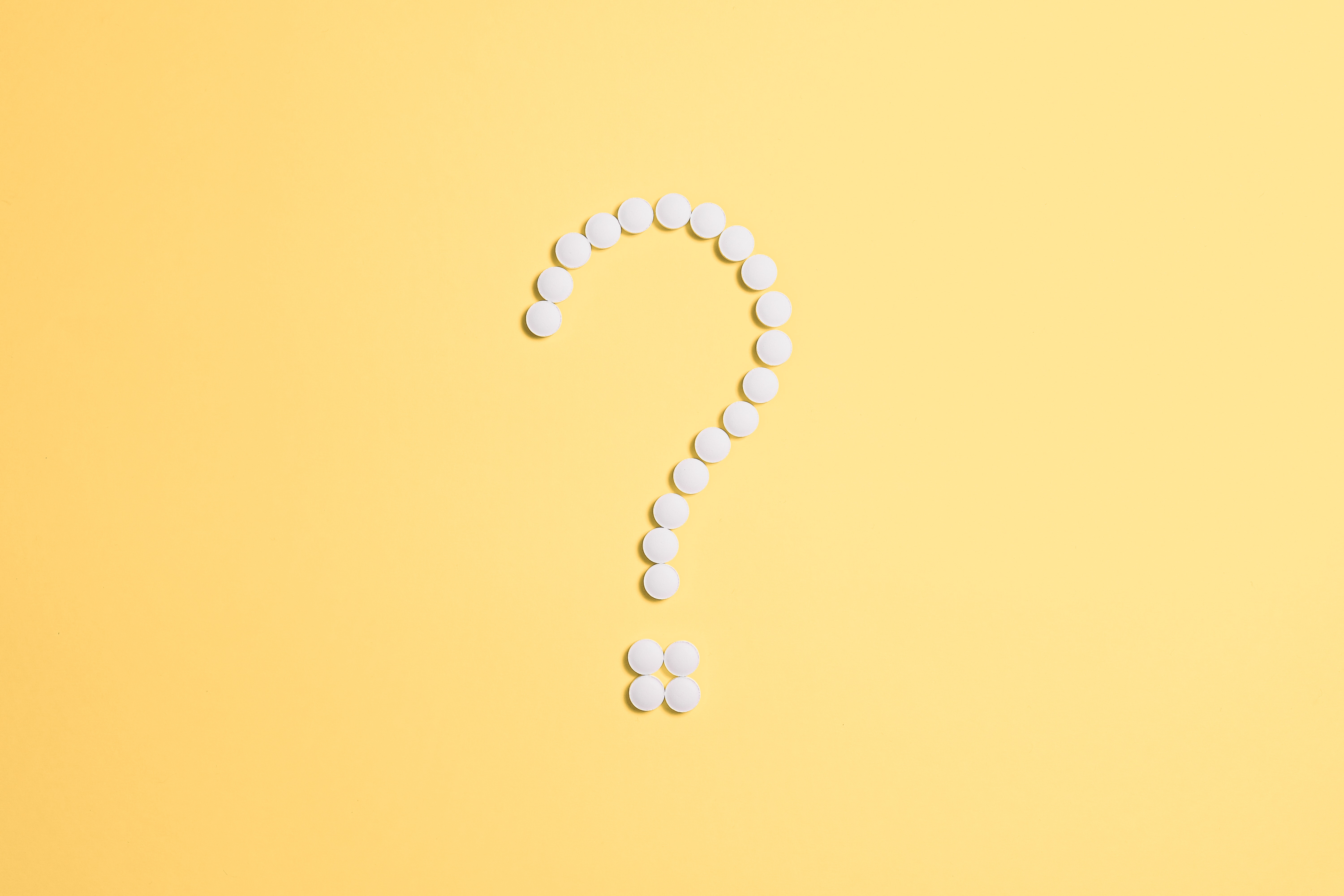 Pills in the shape of a question mark. Image courtesy of Anna Schvets via Pexels