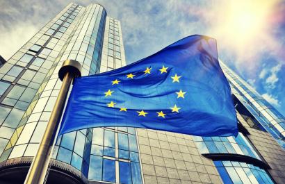 Image by symbiot via Shutterstock. An EU flag flying outside the European Parliament in Brussels, Belgium. Image by symbiot via Shutterstock.
