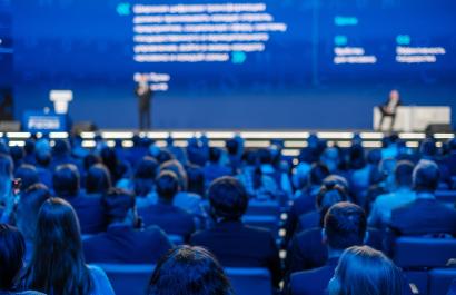 Back view of a crowd at an event. Image by Anton Gvozdikov via Shutterstock.