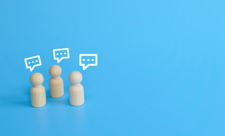 Wooding figures talking, announcing the IHI Brokerage Event and networking opportunities.