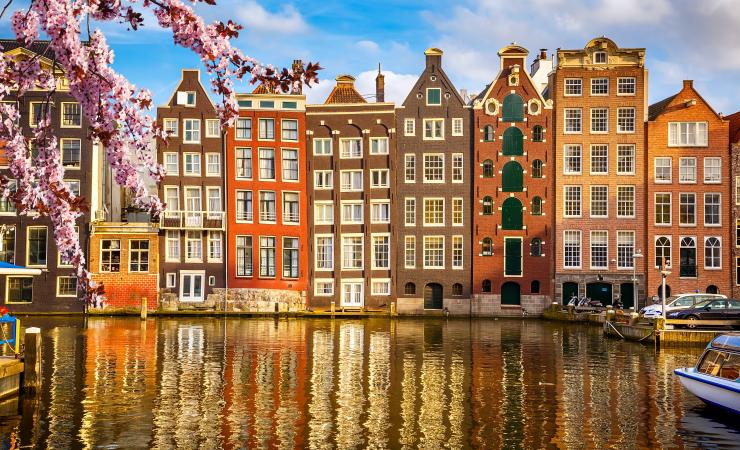 Houses along Amsterdam canal. Image credit: Image sborisov via Adobe Stock. 