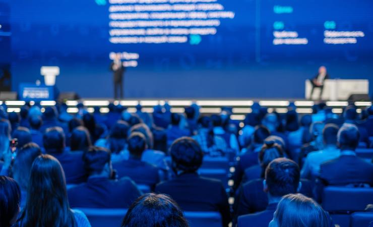 Back view of a crowd at an event. Image by Anton Gvozdikov via Shutterstock.