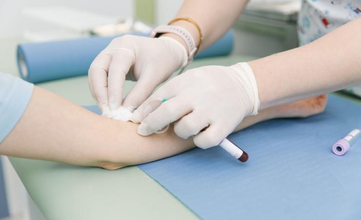 A close-up of a healthcare working carrying out a blood test on a patient. Image by Med Ved via Shutterstock.