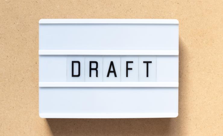 Draft written on a lightbox. The draft call topics set out future research funding opportunities.