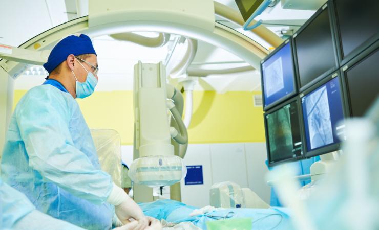 A interventional radiologist at work. Image by Dmitry Kalinovsky via Shutterstock.
