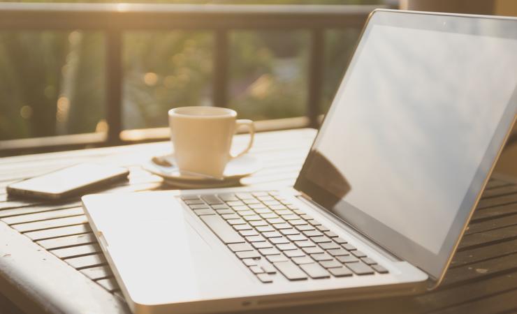 A laptop on a table outdoors. IHI call topics for health research and innovation projects are online