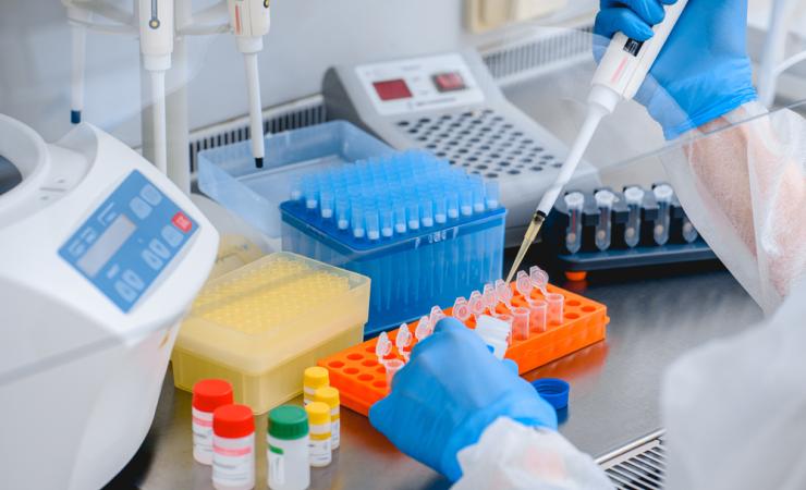 A scientist using a pipette. VIROMARKERS is studying viral infections HIV, hepatitis and CMV.