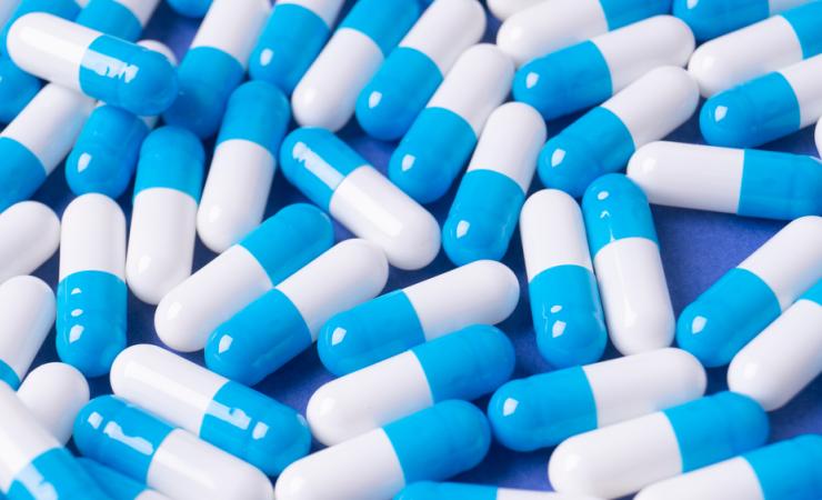 Blue and white pills. The project aims to improve clinical trials of new medicines.