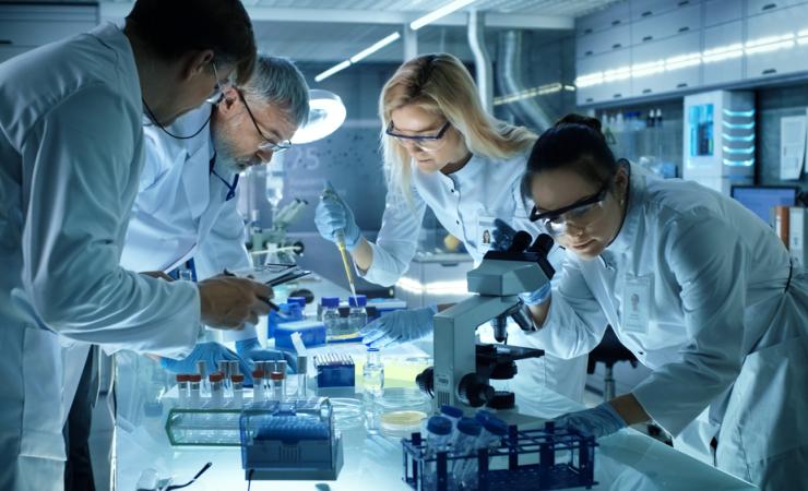 Scientists working in a lab. Image credit: Gorodenkoff via Shutterstock.