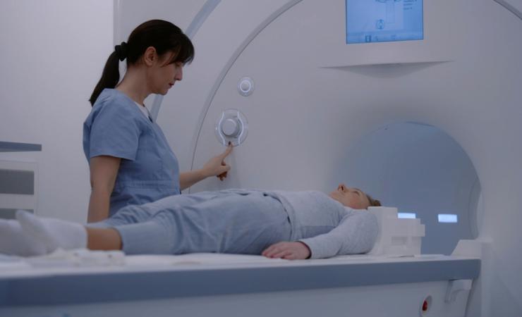 A woman undergoing a scan in a hospital. Image by Frame Stock Footage via Shutterstock.