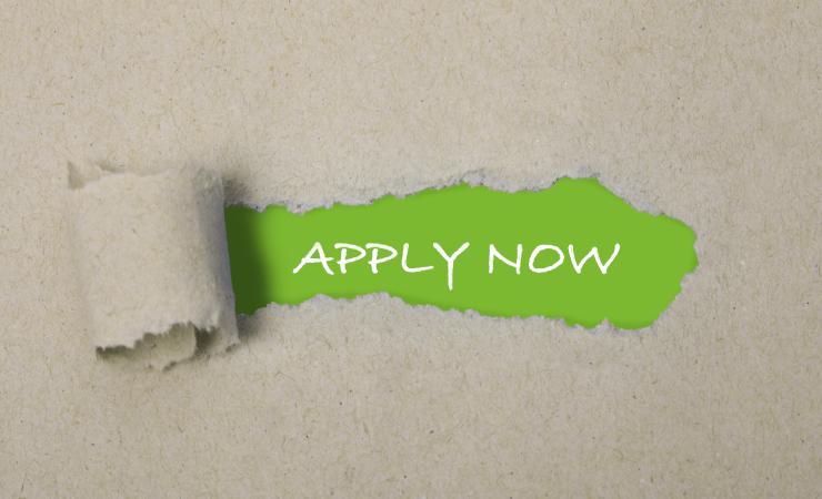 Most of the image is rough brown paper. In the centre, this is ripped away to reveal the words 'apply now' written in white on a green background. Original image by Marta Design via Shutterstock, modified by IHI.