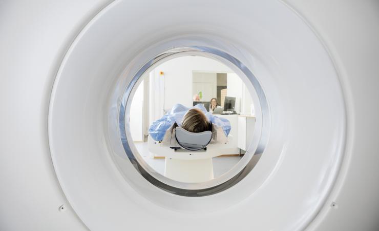 A woman undergoing a CT (computed tomography) scan. Image by Tyler Olson via Shutterstock.