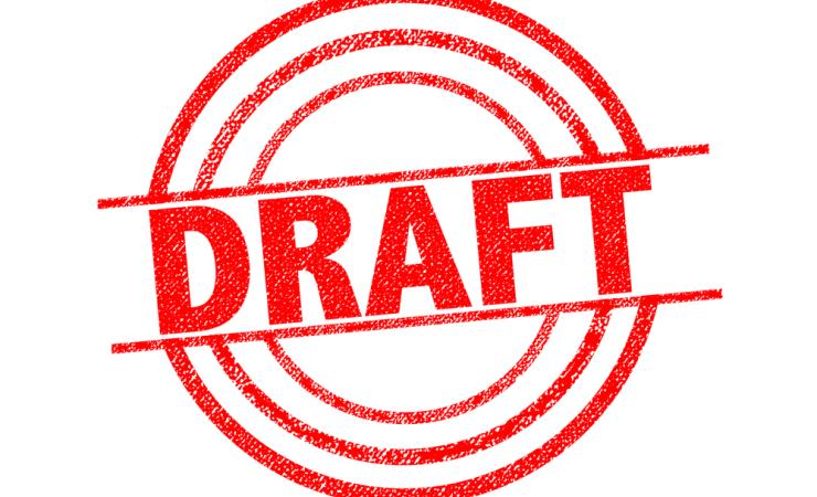 The word DRAFT stamped in red on a white background. Image by chrisdorney via Shutterstock