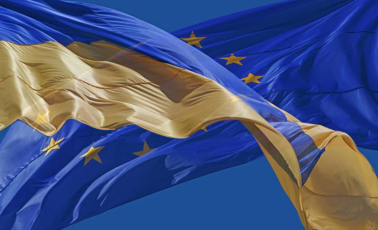 The flags of Ukraine and the EU. Image by Roman Malanchuk via Shutterstock