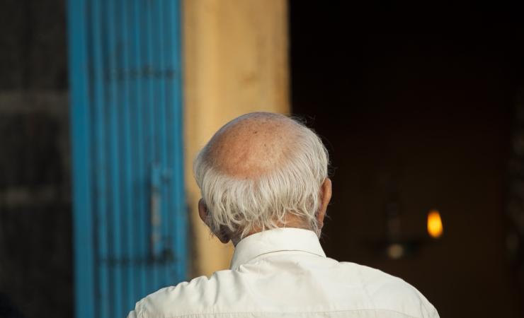 Old man from behind. Image by tiffgraphic shutterstock