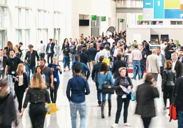 A crowd at an exhibition. Image via Shutterstock id: 719939668