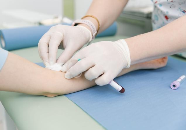 A close-up of a healthcare working carrying out a blood test on a patient. Image by Med Ved via Shutterstock.