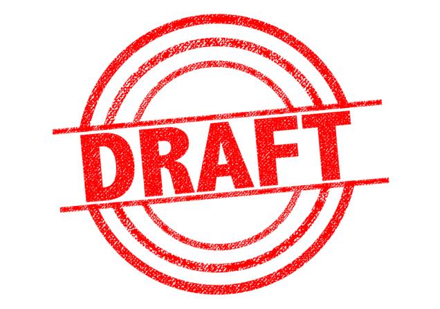 The word DRAFT stamped in red on a white background. Image by chrisdorney via Shutterstock