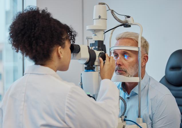 Person undergoing an eye exam. Image credit: People Images - Yuri A via Shutterstock.