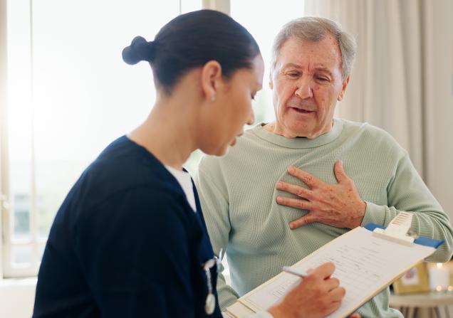 Heart patient filling out a PROM with help from a doctor. Image credit: WesleyJVR/peopleimages.com via Adobe Stock.