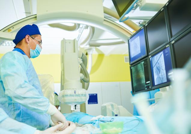 An interventional radiologist at work. Image by Dmitry Kalinovsky via Shutterstock.