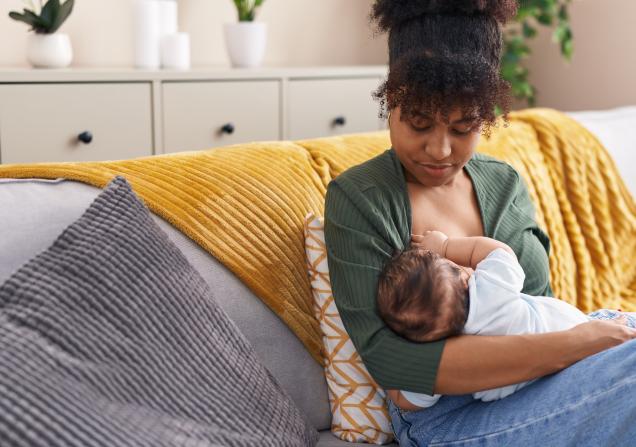 A woman breastfeeding her baby. Image credit: Kraken images via Shutterstock.