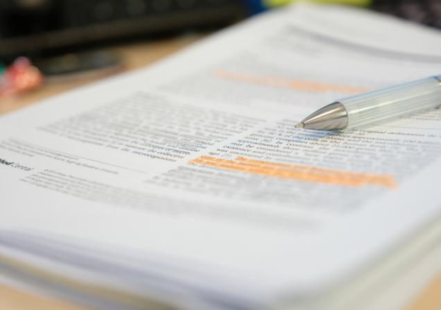 A pen on a scientific paper. Image credit: PolyPloiid