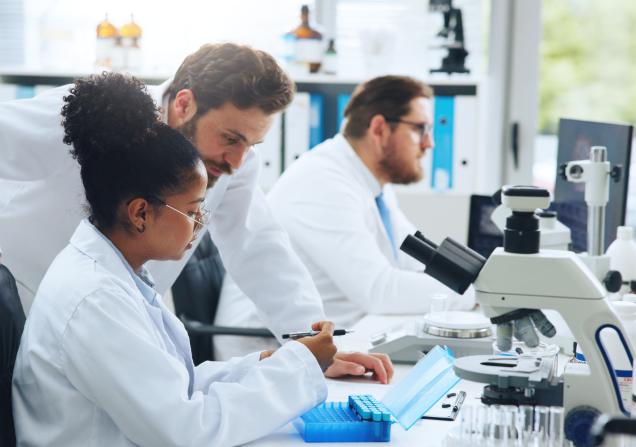 Scientists working together. Image credit SiphosethuFan via Adobe Stock.