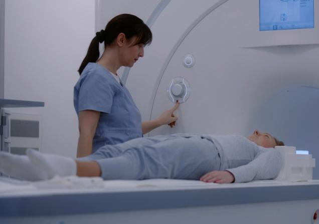 A woman undergoing a scan in a hospital. Image by Frame Stock Footage via Shutterstock.