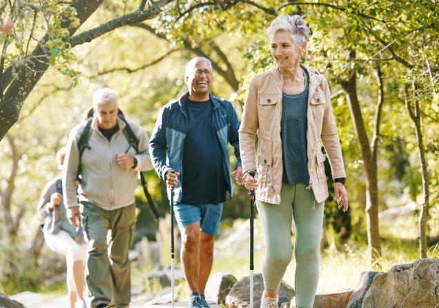 Elderly people walking in a forest. Image credit: PeopleImages.com YuriA via Shutterstock