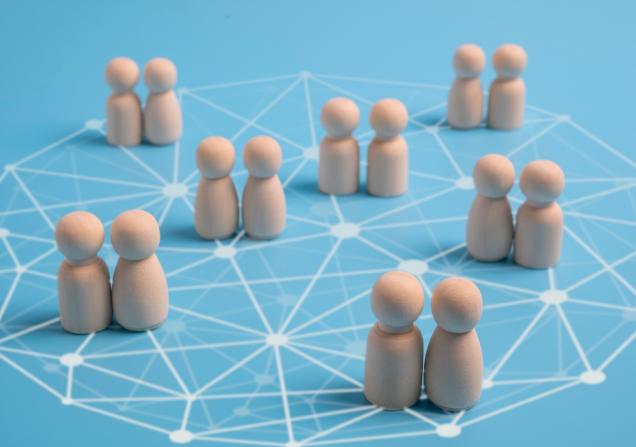 Wooden figures networking. Image by oumjeab via Shutterstock