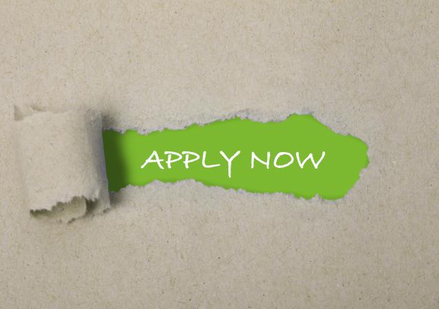 Most of the image is rough brown paper. In the centre, this is ripped away to reveal the words 'apply now' written in white on a green background. Original image by Marta Design via Shutterstock, modified by IHI.