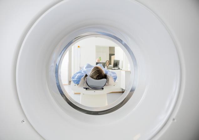 A woman undergoing a CT (computed tomography) scan. Image by Tyler Olson via Shutterstock. 
