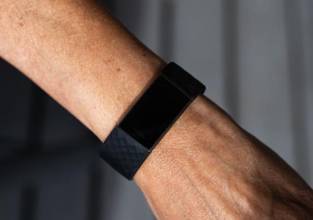 A fitbit on a bare arm. Image by Ingrid Emilie S Hansen via Shutterstock