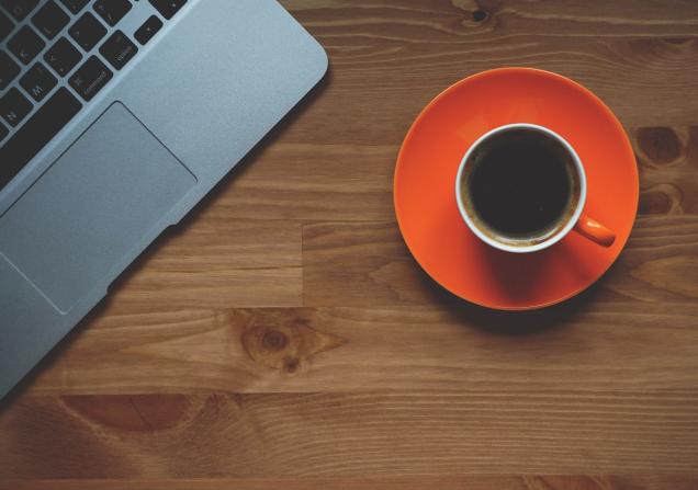 Laptop and cup of coffee. Image by freephotocc via Pixabay.