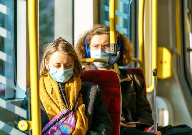 People on a tram wearing masks. Image by Orso via Shutterstock