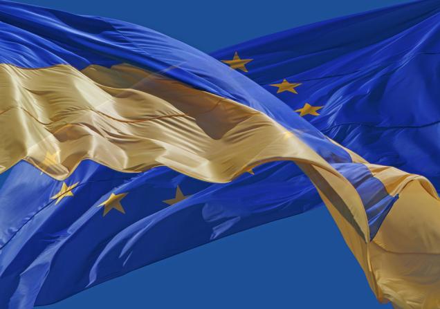 The flags of Ukraine and the EU. Image by Roman Malanchuk via Shutterstock