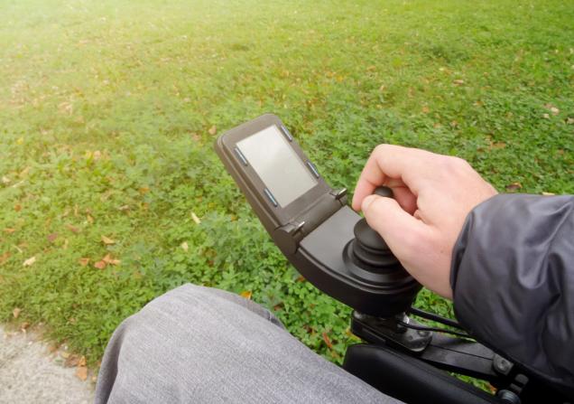 A person driving a wheelchair. Image by 24kProduction via Shutterstock
