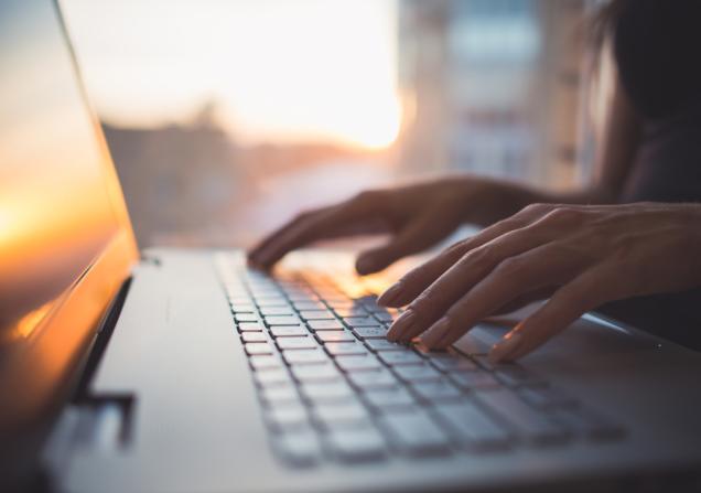 Woman typing. Image by Undrey via Shutterstock