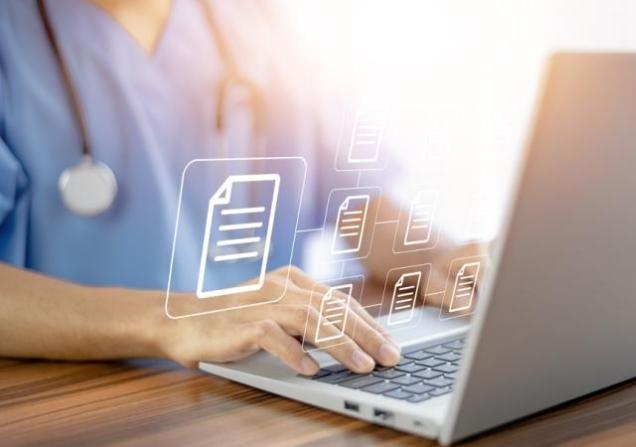 A doctor views treatment guidelines on a computer. Document icons float in the air.