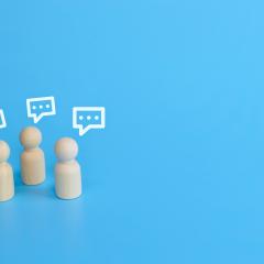 Wooding figures talking, announcing the IHI Brokerage Event and networking opportunities.