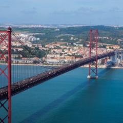 Lisbon. Image by Hivaka via Shutterstock. View of the 25 de Abril Bridge and the river in Lisbon. Image by Hivaka via Shutterstock.