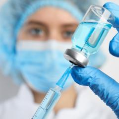 Doctor filling syringe with medication, closeup. Vaccination and immunization. Image by New Africa via Shutterstock Doctor filling syringe with medication, closeup. Vaccination and immunization. Image by New Africa via Shutterstock