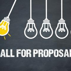 Call for proposals text with a drawing of lightbulbs hanging and swinging against each other, as in Newton's experiment. 