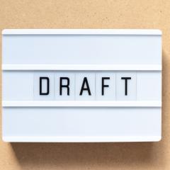 Draft written on a lightbox. The draft call topics set out future research funding opportunities.